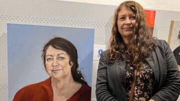 Suzannah Jones next to the winning portrait of herself by Sandra Lalopoulos. Picture by Angus Michie