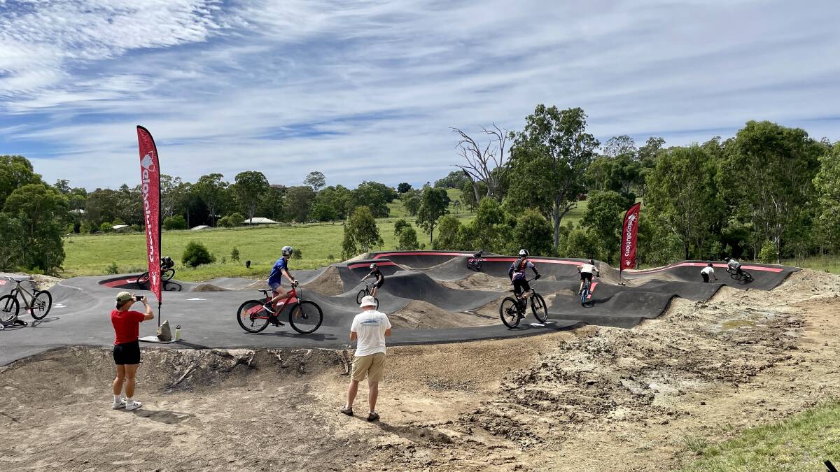 Local kids riding the Dungog Common's new pump track. Picture by Angus Michie.