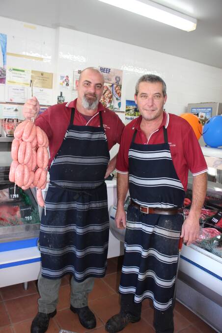 Jon Martin (left) with Peter Eyb who is celebrating 25 years in business in Dowling Street Dungog.