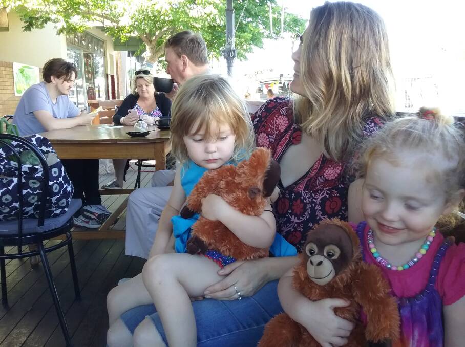 FUTURE GENERATIONS: Evelyn Christie and Rose Norris with their toy orangutans Georgina Clark brought them home from Borneo following her trip to learn more about the endangered animal.