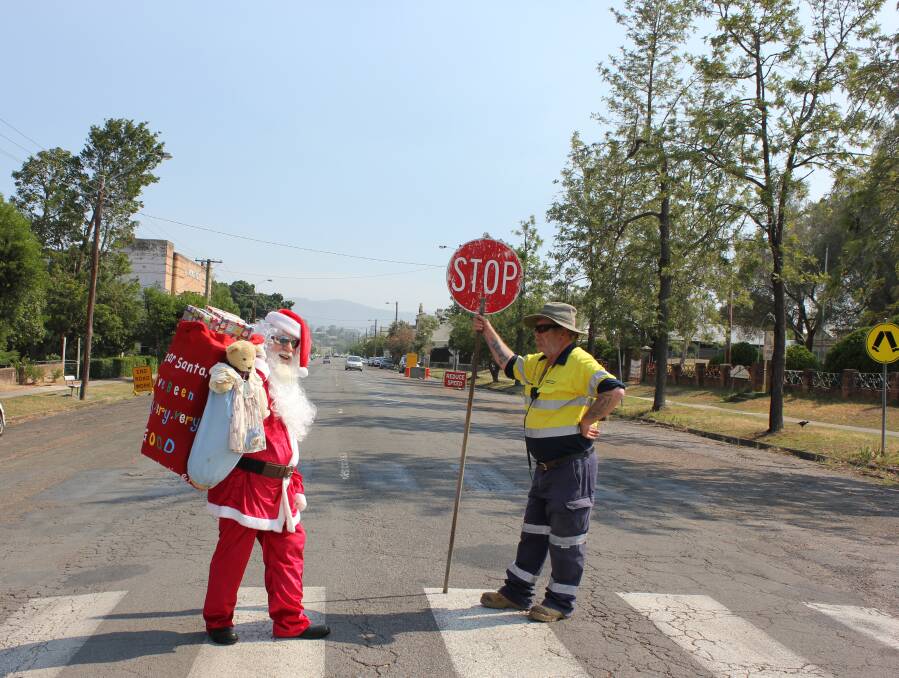 SANTA PLEASE STOP: There's no way the Dowling Street roadwork will stop Santa Claus from attending the annual Christmas community lunch on December 25.