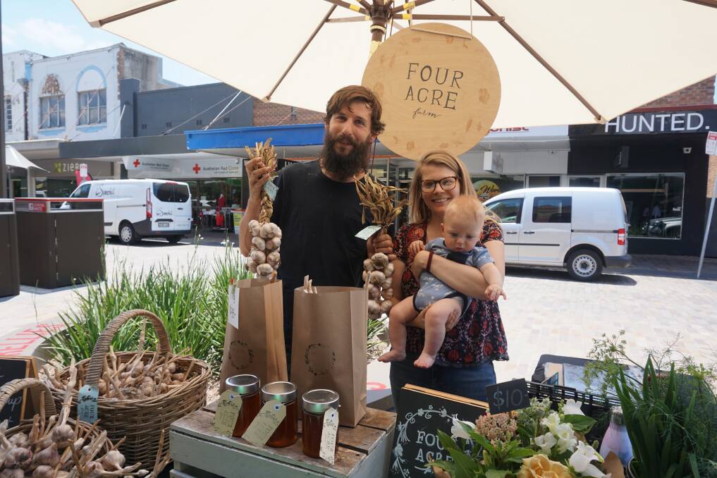 GARLIC WIN: Farmers Tom Christie and Dominique Northam with their son Jude at the Slow Food Earth Market.