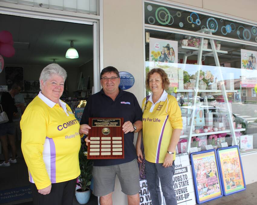 WINNER: Co-chairs of the organising committee Margaret Jones and Lyn Moseley with Peter Maytom from Dungog Newsagency, the winner of the committee's choice window. 