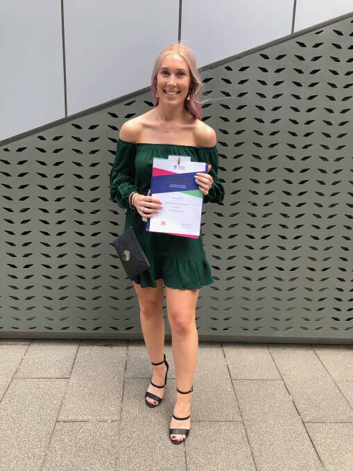 ACHIEVEMENT: Ellie Waight with her award presented at Parliament House on Monday - she was equal first place in the state for the Retail Services Examination, receiving the award on Monday ahead of the HSC results.