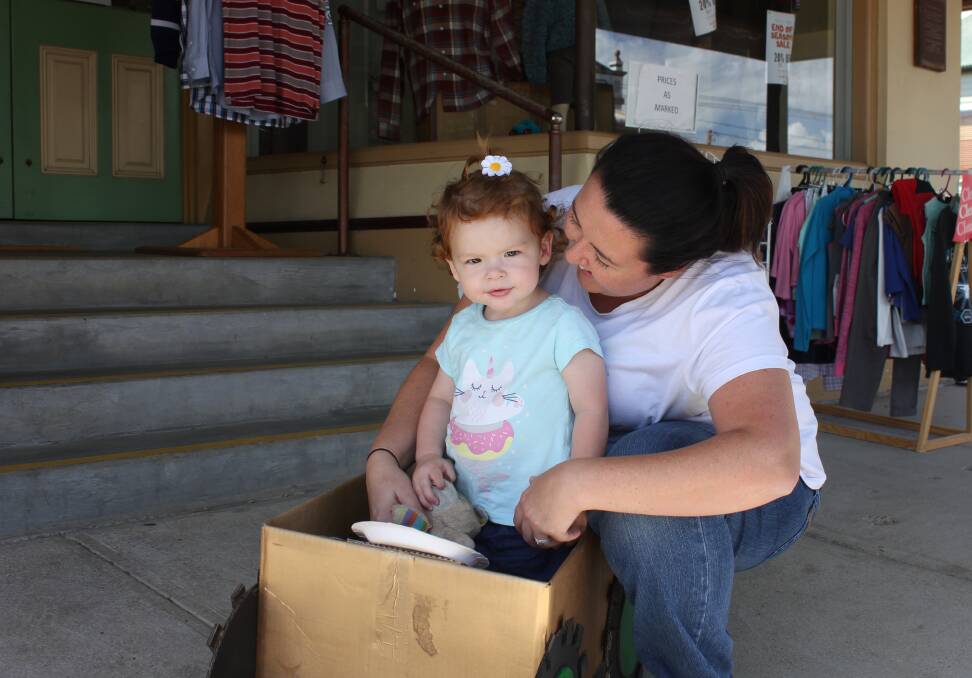 YOUNG COMPETITOR: Elenore Lawrence, 20 months, takes her box car for the derby out for a spin with a little bit of help from mum Brianna.
