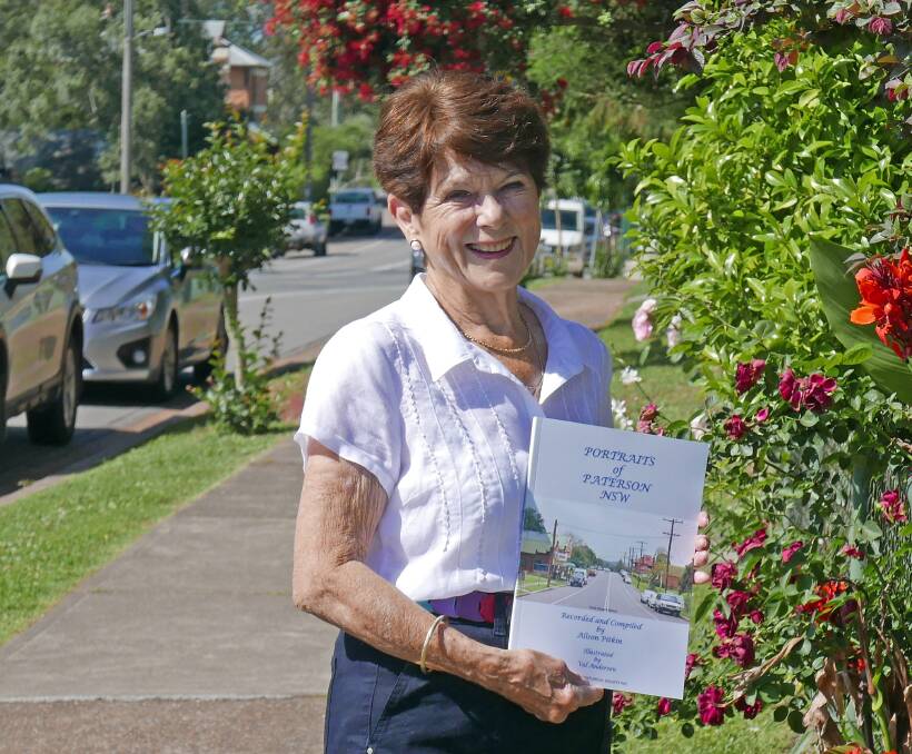 Author Alison Pitkin with her latest book on Paterson.
