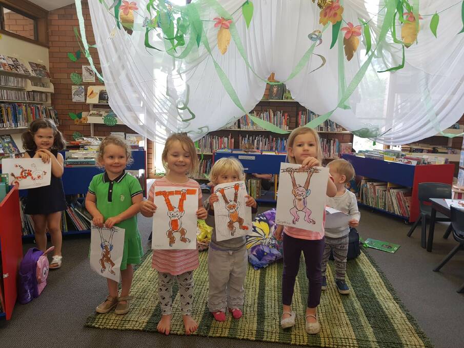 READING IS FUN: Having a great time at the monkey story time at Dungog Shire library last week were little book lovers Vayda, Bonnie, Aubrey, Ada, Sophia and Lucas.
