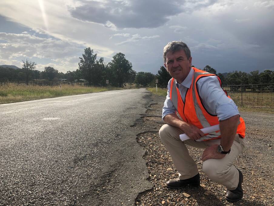  FUNDING: Dr Gillespie inspecting Gresford Road at Vacy which is to receive federal government black spot funding.