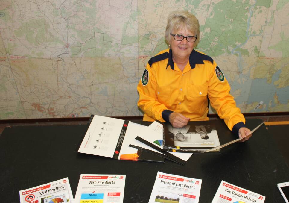 PLAN: Dungog Rural Fire Service's Community Engagement Officer, Wendy Howard, looks over a hard copy of the plan which is also available on the internet.