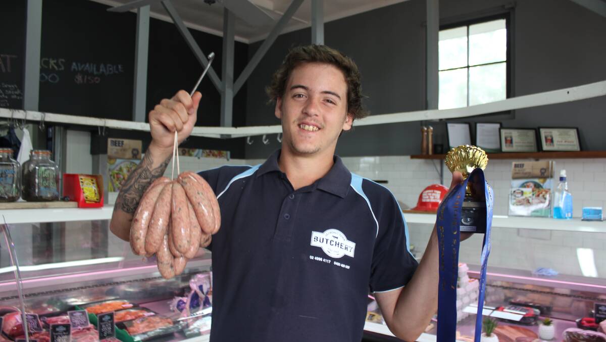 WINNER: Butcher Danny Searl and his award-winning sausages (and trophy to prove it) at the Clarence Town Butchery.