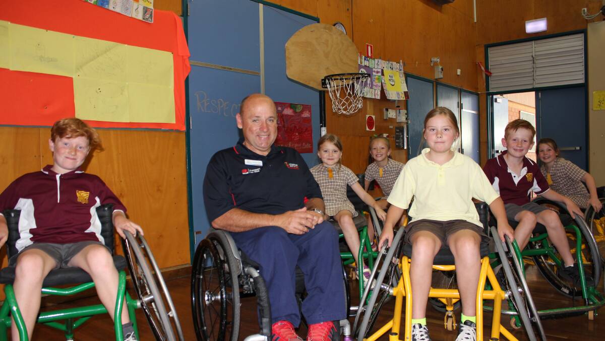 LEARNING: Brendon Talbott from Wheelchair Sports NSW with students at Dungog Public School.