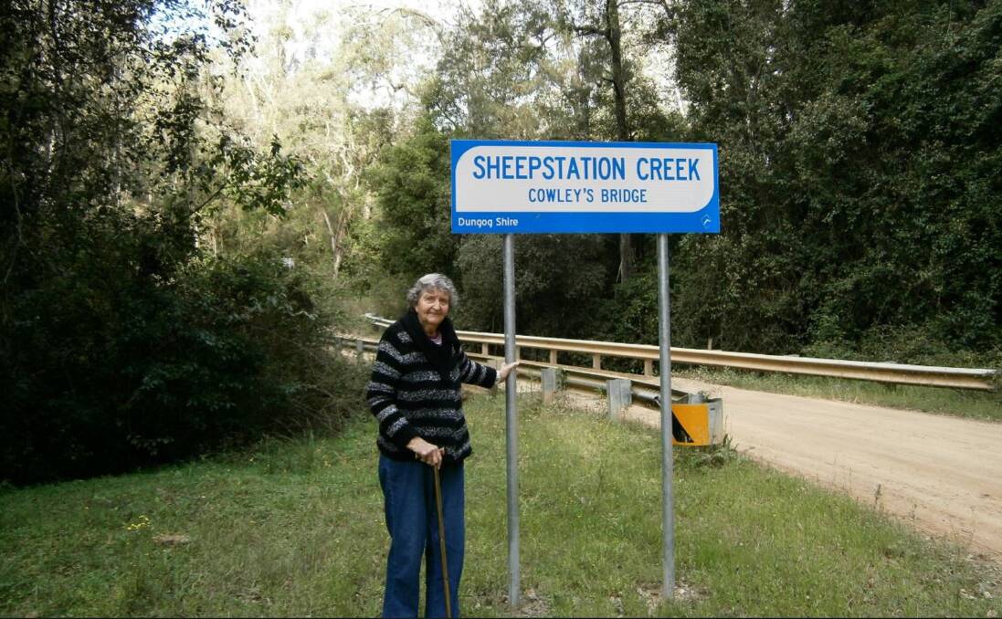 History: Mrs Cowley on the bridge on the gravel section of the Paterson River Road about 29 km north of Gresford. The timber bridge was replaced with a single lane concrete structure in 2005. Photograph: Sarah Cooper. 