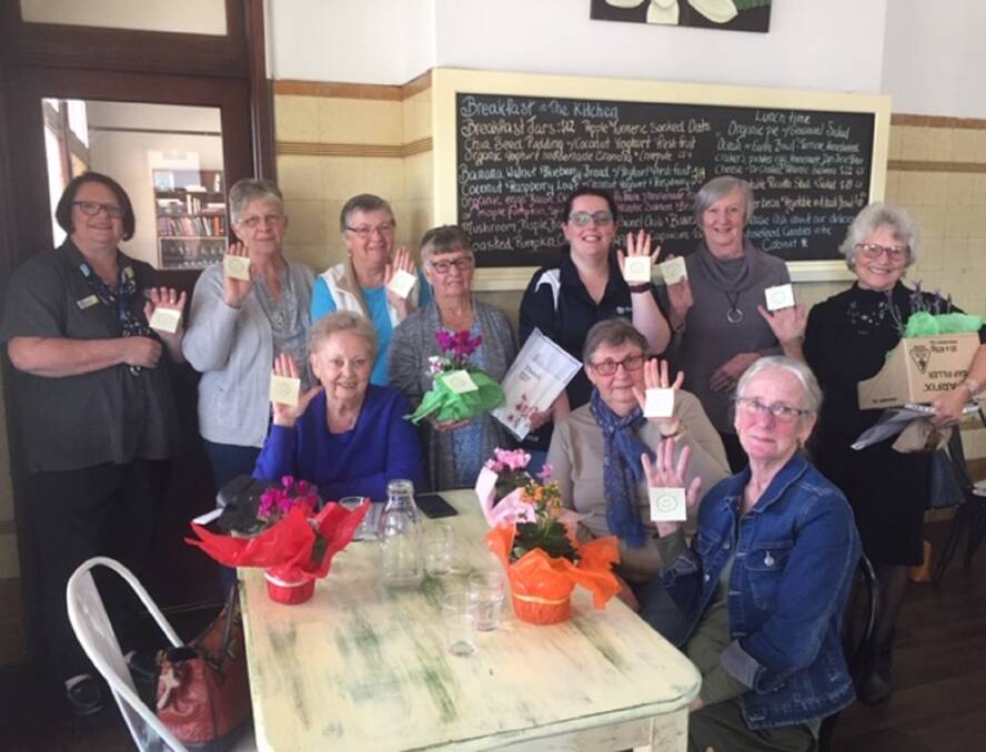 Thank you: Lara manager Jo Earley (far left) with the volunteers who give their time at the aged care facility, enjoying a morning tea celebration at Meg's Kitchen.