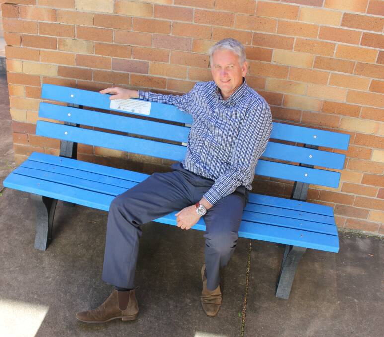NEW AGE SEATING: Council’s Manager of Environmental Services Paul Minett with the new bench seat made from the equivalent of more than 15,000 plastic bags.