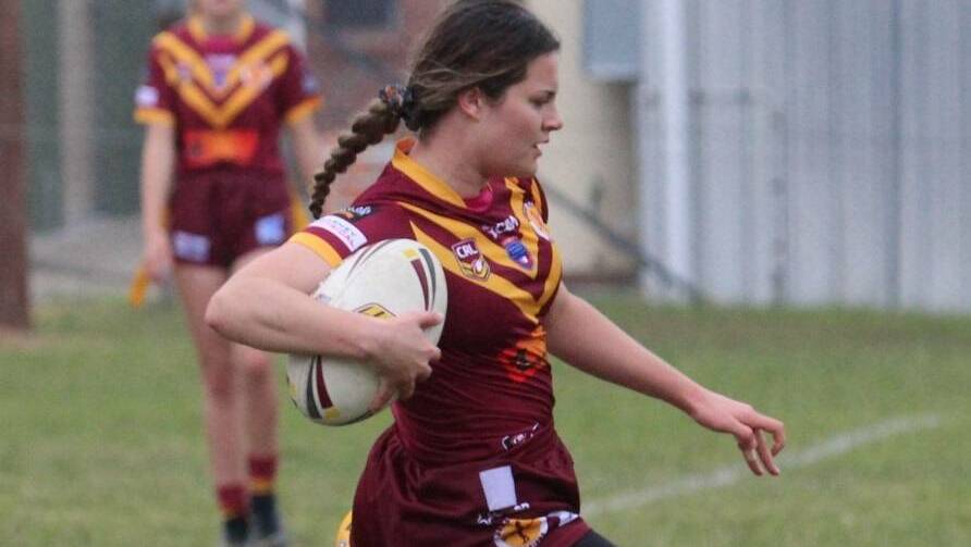 ELUSIVE: Lilly Hooke was pulled up just short of scoring a try.