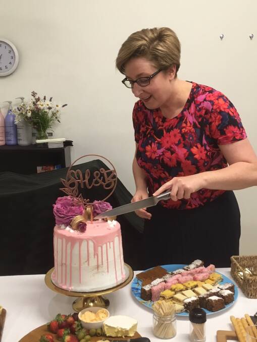 SPECIAL: Sonia Bowden cuts the birthday cake.