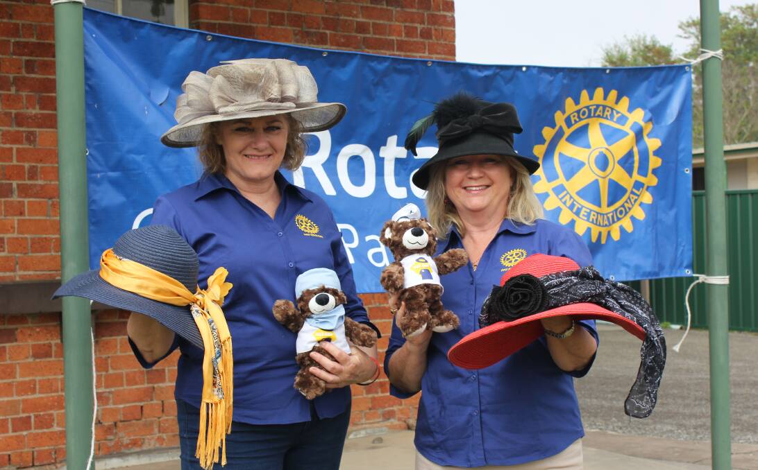HATS OFF: Cath Varcoe and Ann Callaghan have their hats ready for the big day, pictured with some merchandise for sale.