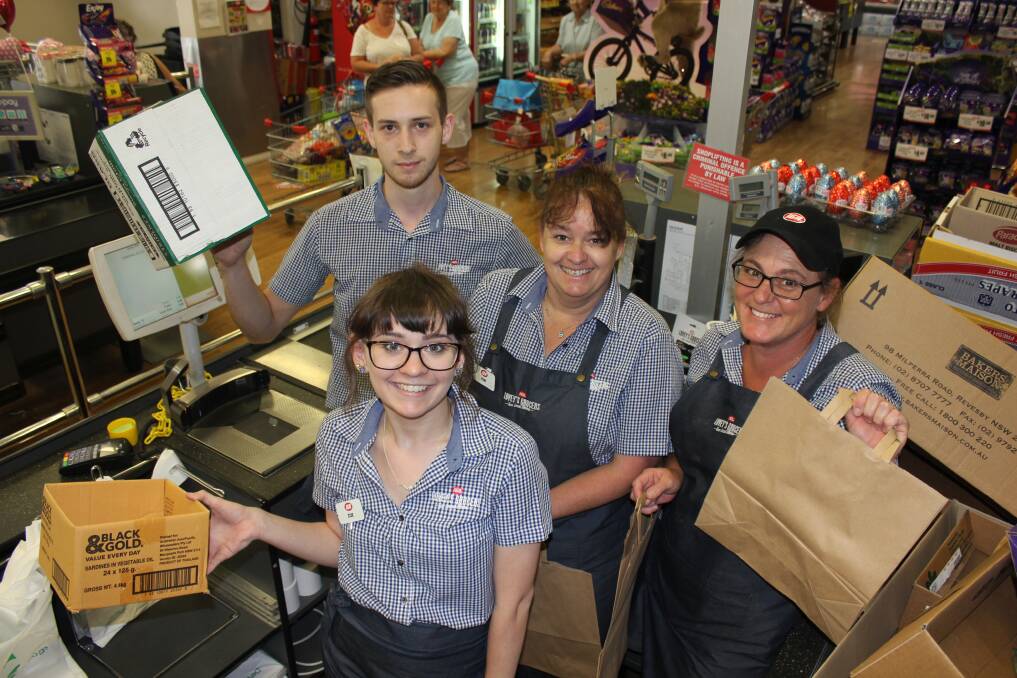 DO YOU WANT A BAG WITH THAT: Lovey's IGA staff members embracing the no plastic bag life - Zoe Hopson (front), Daniel Muddle, Kim Hopson and Deb Taylor.
