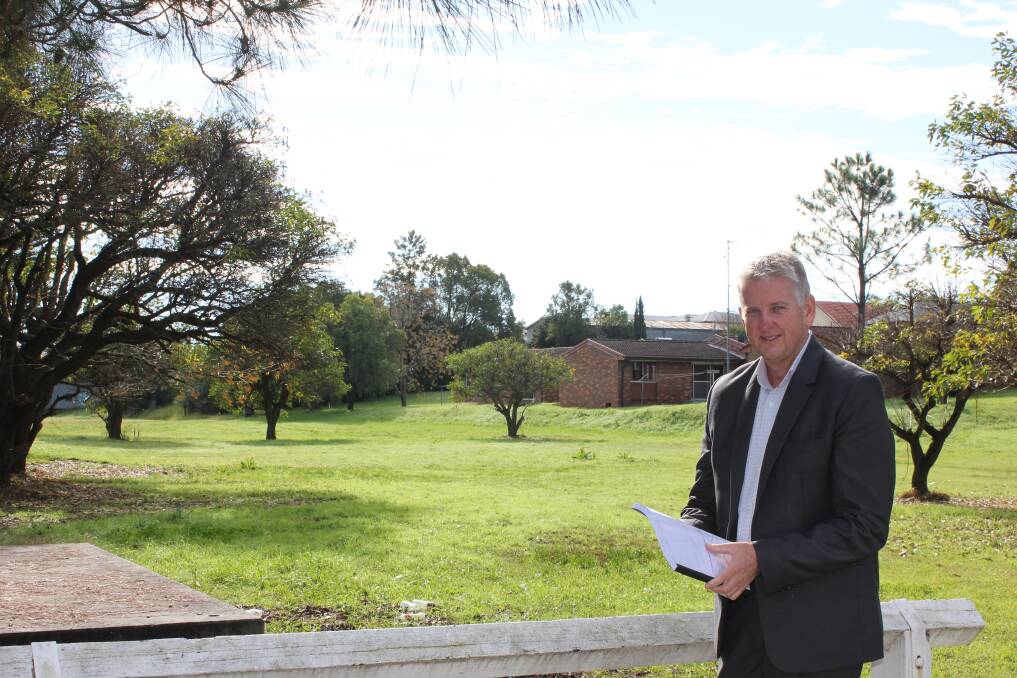 Paul Minett - Dungog Shire Council's Manager Environmental Services pictured earlier this year with the council's flood document.