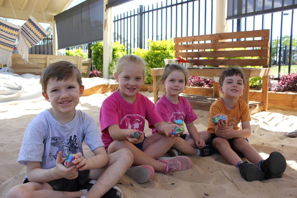 Happiness project: Boston, Gracie, Natahlia and Emerson from Dungog Community Preschool with some of their painted rocks they have planted around the town.
