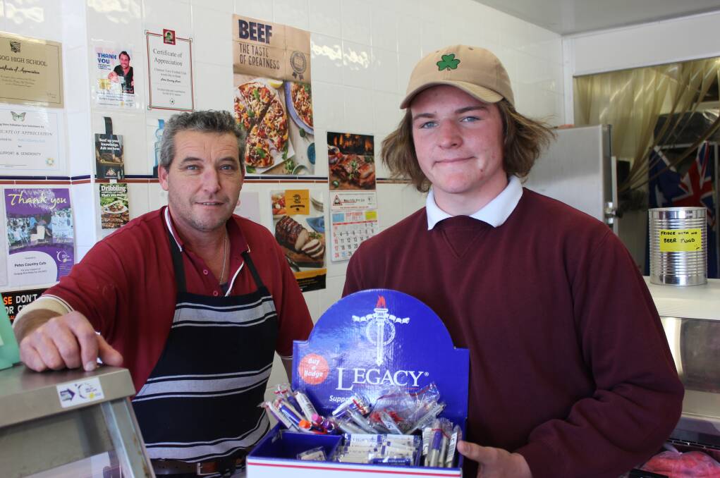 DONATIONS: Peter Eyb from Pete's Country Cuts in Dowling Street buys some products from Dungog High School's Ethan Curtin-Edwards who was volunteering for Legacy.