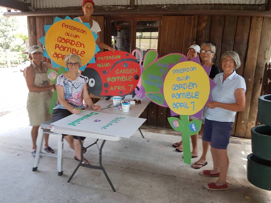 READY: Members of PAGG Inc preparing the roadside signs which have gone up around the Shire and especially in the Paterson Allyn valleys. Photo: Lisa Connors