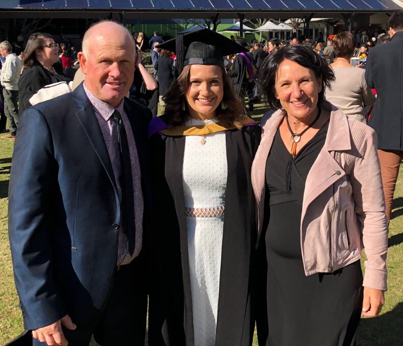 Dr Barnes: Elli Barnes with her parents Rodney and Anne on her graduation day.