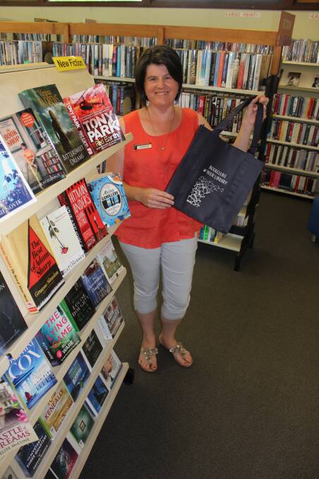 Reusable alternative: Dungog Librarian Amanda Field with one of the new library bags now for sale to help people limit the use of single-use plastic bags.