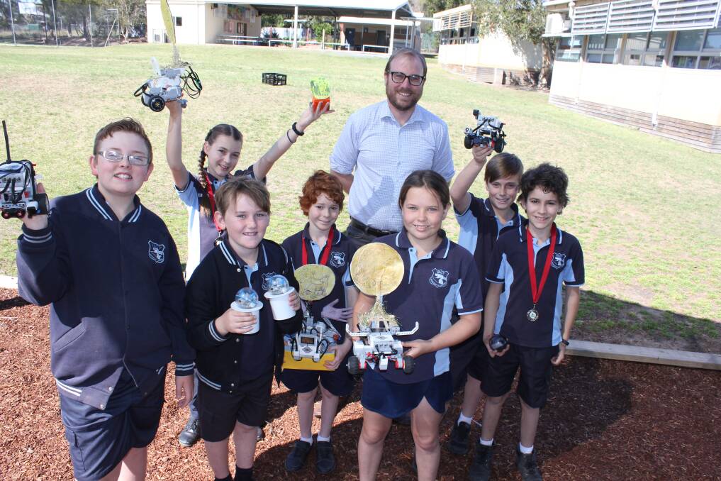 CLEVER: Vacy Public School teacher Lachlan Prior with students Lars Ulrick, Madison McCosker, Samuel Smith, James McCosker, Fay Magri, Jesse Johnson and Harry McCosker who will compete in a national robotics competition.