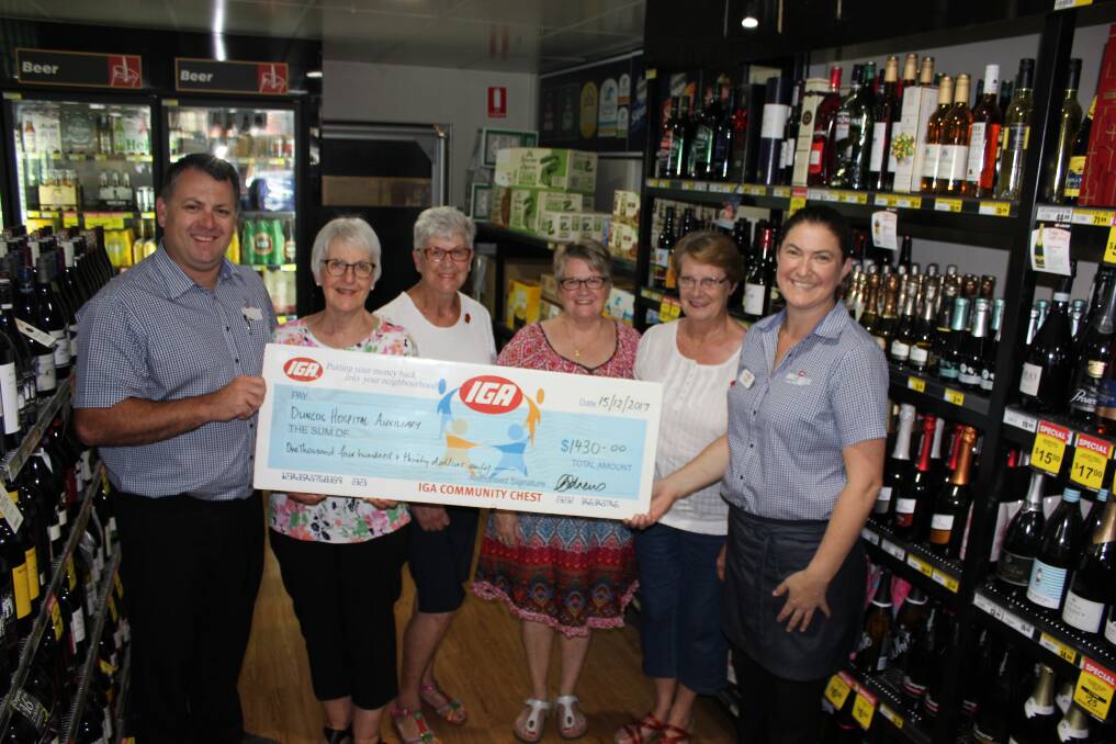 DONATION: Lovey's IGA's James Lovegrove, left, and  Caz Andrews, far right with auxiliary members Lyn Lovegrove, Judy Berry, Chris Studdert and Pat Hartcher.