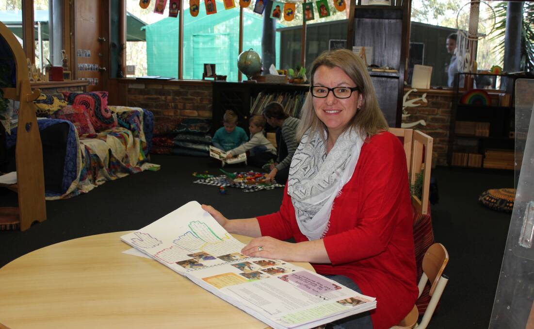 ACCREDITATION: Clarence Town Preschool Director Rebecca Boland with the journal of the children's learning adventures. Photo: Michelle Mexon