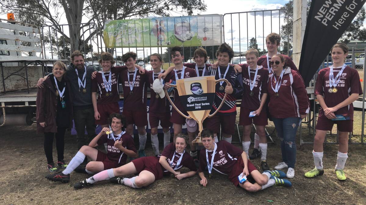 Winners are grinners - Dungog Under 17 soccer players and officials.