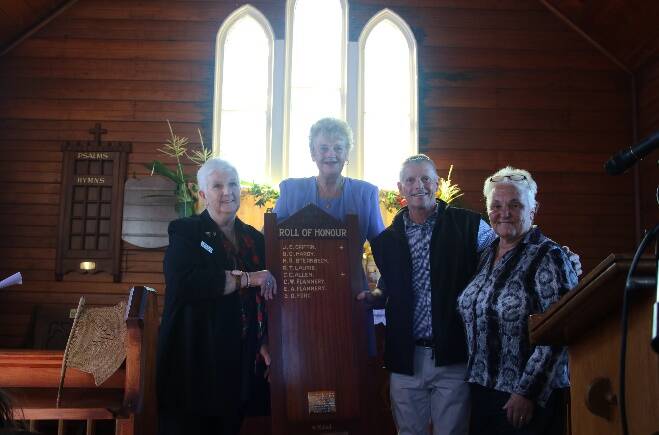 Di Bennett (left) on behalf of the Clarence Town ANZAC Committee, receiving the Roll of Honour from Parishioners Kay Bagnall, Steve Gorton and Sue Flannery.
