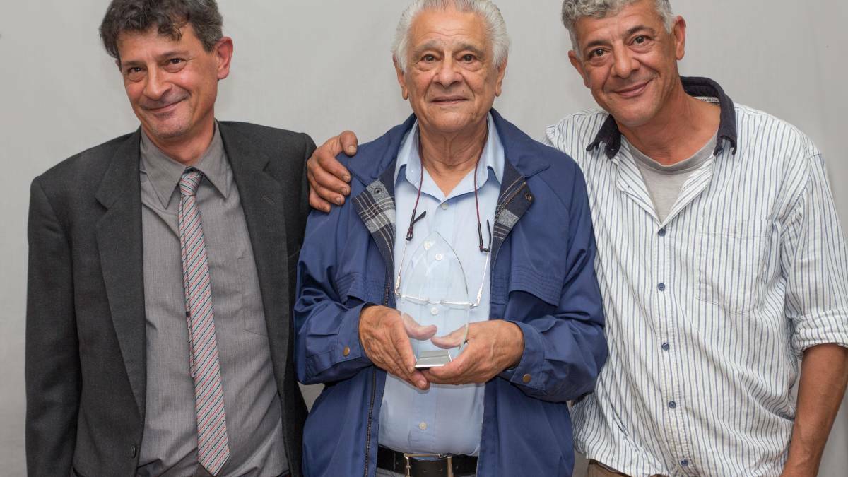 Chris Iacono, pictured centre with his sons, was the first person to be inducted into the Hall of Fame at the 2017 Dungog District Chamber of Commerce Awards.