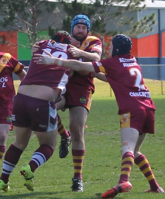 The Warriors defence takes on an Abermain player. Picture: Jeanie Briggs
