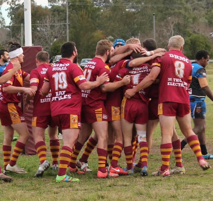 JUBILANT: The Warriors celebrate another try as they turned a 14-point into a 42-20 victory against league leaders Carrington. Picture: JEANIE BRIGGS
