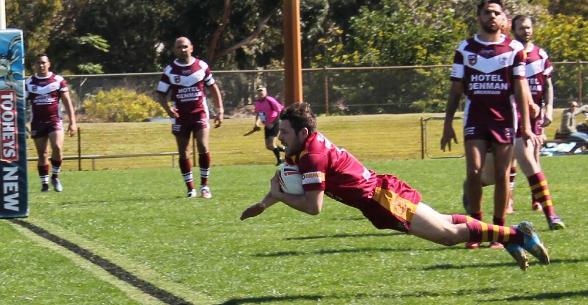 Dungog's Leeroy Nevin finds plenty of space to dive in for a try. Picture: Jeanie Briggs