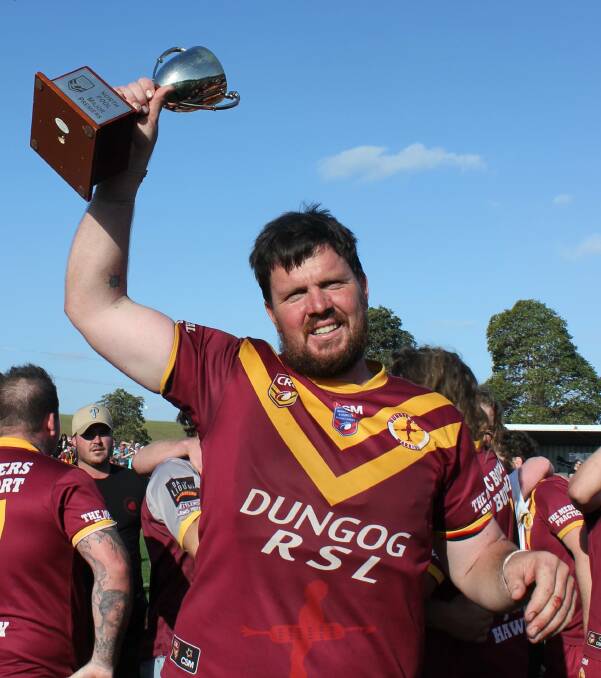 LEADER: Matt Hinton proudly holds the 2019 premiership cup aloft. The 2019 captain will be back this season as captain-coach. Pictures: Michelle Mexon