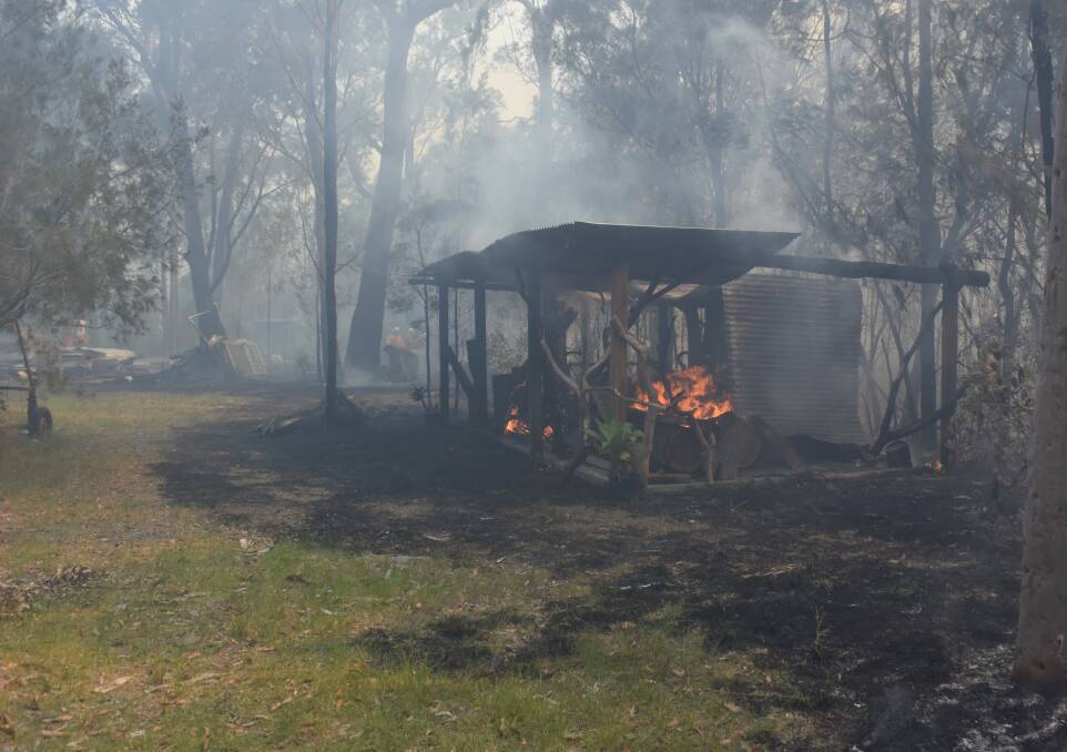 LABOUR OF LOVE: Owen Davis at Twelve Mile Creek had just finished building this wood shed. After eight years in the bush, fires are a "constant concern" in summer.