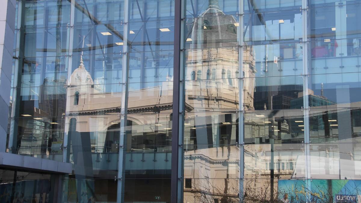 Old and new … The famous old Exhibition Building reflected in the modern façade of the Melbourne Museum. 