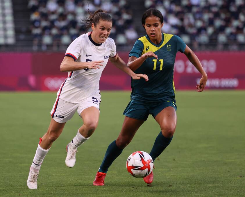 FOCUSED: Australia's Mary Fowler (right) chases after US opponent Kelley O'Hara during their draw at Kashima Stadium on Tuesday night. Picture: Atsushi Tomura/Getty Images