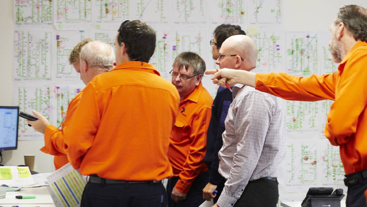 PLANNING: Some of the Ausgrid crew who formed a plan to attack the widespread power outage caused by the super storm.