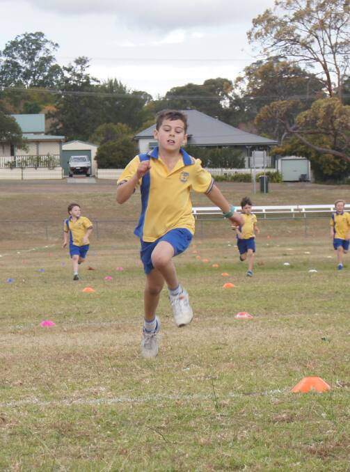 RUNNER: Darcy Hopwood, 8, competing in a 200 metre race during the St Joseph's Primary School sports carnival. Picture: BELINDA-JANE DAVIS