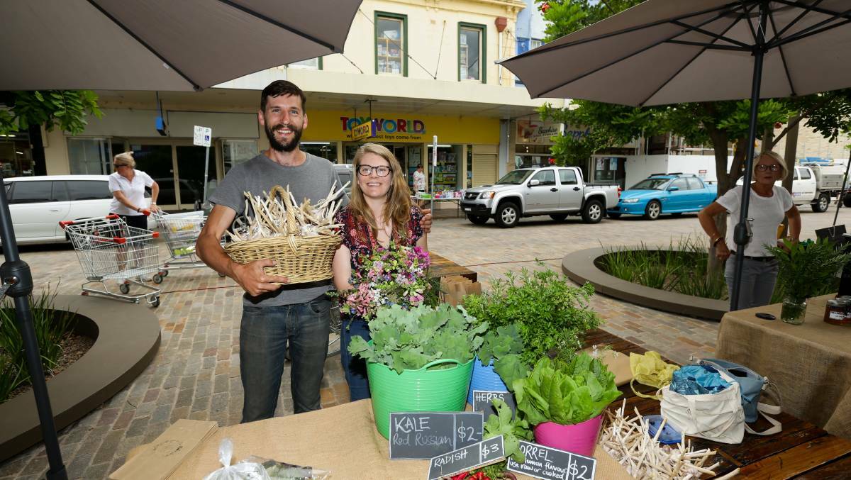 WATER SHORTAGE: Tom Christie and Dominique Northam pictured at the Slow Food Earth Market in Maitland during better times last year. Picture: Jonathan Carroll.