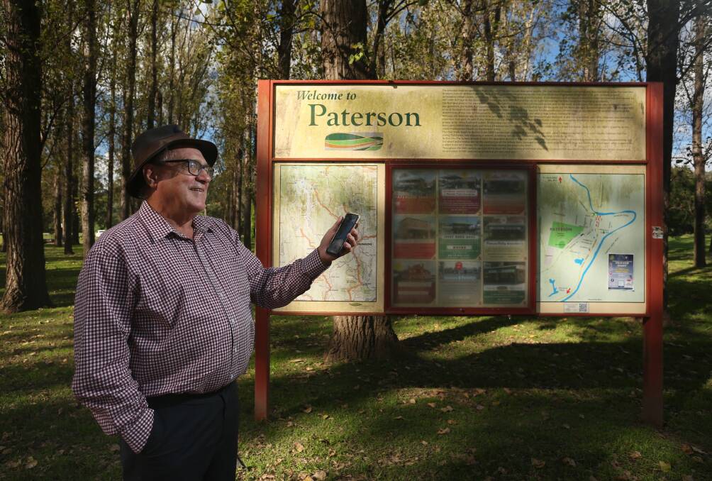 TOURISM PUSH: Chair of Dungog Regional Tourism and Paterson Historical Society President Cameron Archer with a tourist sign in Tucker Park, Paterson. Picture: Simone De Peak