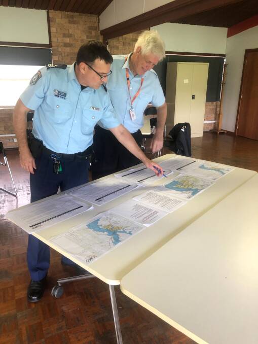 READY: Detective Sergeant Nathan Abbott and SES unit commander Hunter Capability Unit Vic Weller at the Dungog evacuation centre on Monday. 