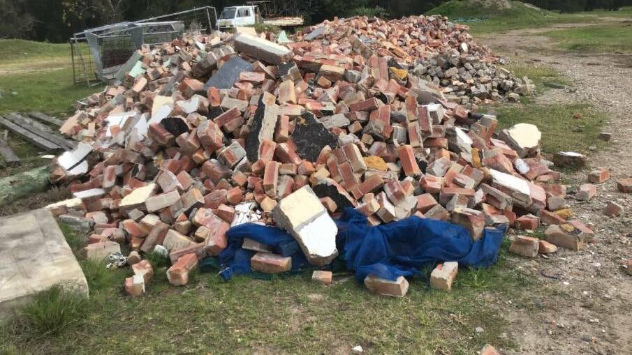 DUMPED: Newcastle councillor Allan Robinson pleaded guilty after a company of which he is a director, dumped waste from the former Maitland Leagues Club buiding, illegally on a site at Woodberry PICTURE: Lake Macquarie City Council.