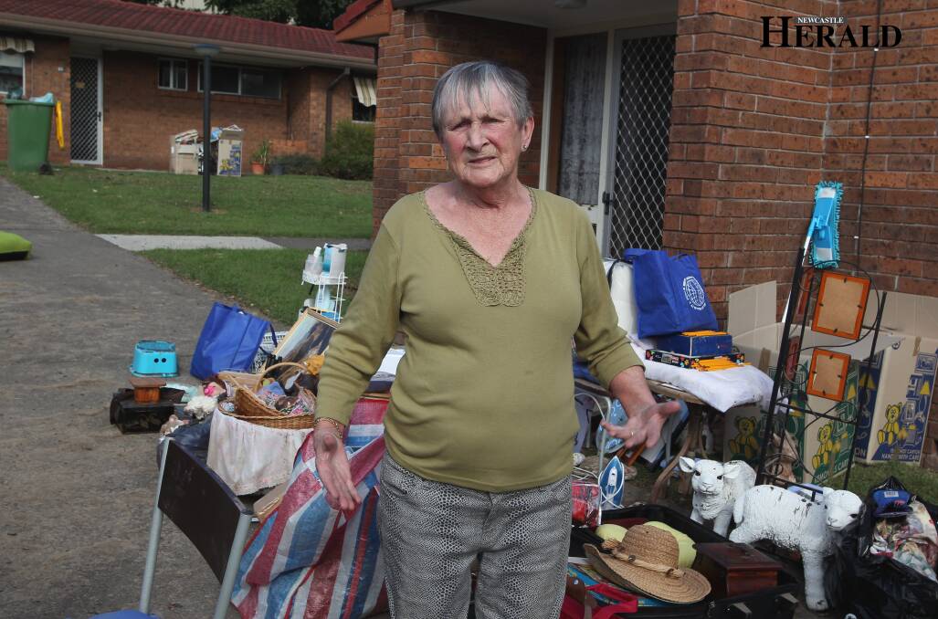 MOVING HOME: Dot Handley, pictured outside her unit after the April 2015 superstorm, is also moving back into her unit this week. Photo courtesy of the Newcastle Herald