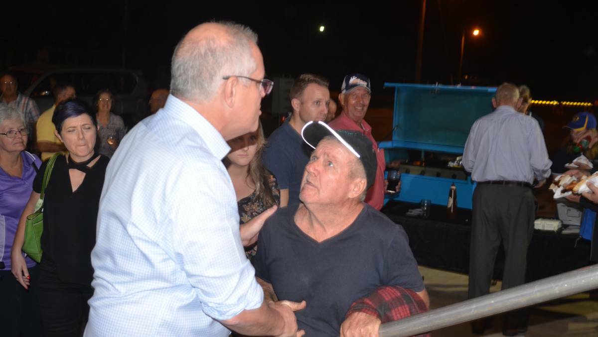 The PM greets a local in Cloncurry just three days after his election win in 2019. Photo: Derek Barry