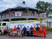 THANK YOU: Port Stephens SES volunteers with members of the Hinton community at the Victoria Inn Hotel on Thursday.